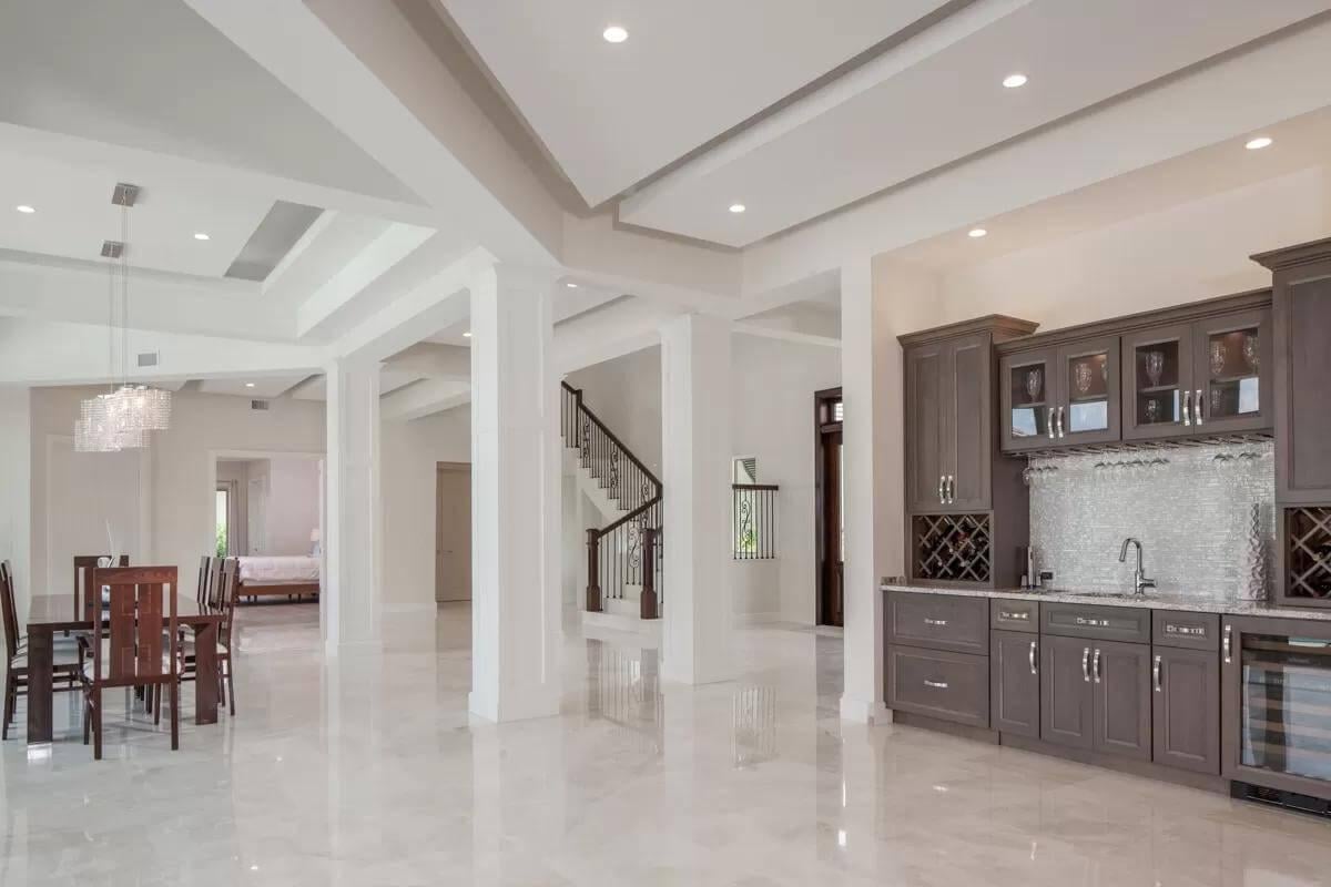 Open Concept Living with Elegant Tray Ceilings and a Chic Wet Bar