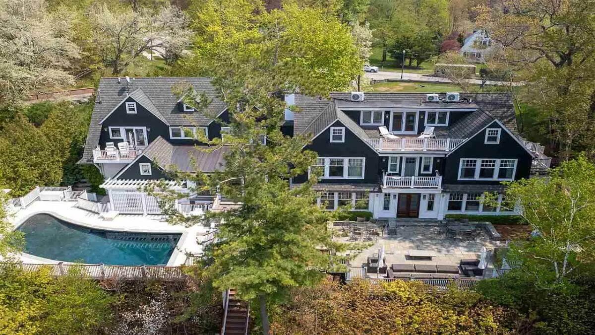 Stunning Colonial Revival with Wraparound Deck and Poolside Oasis