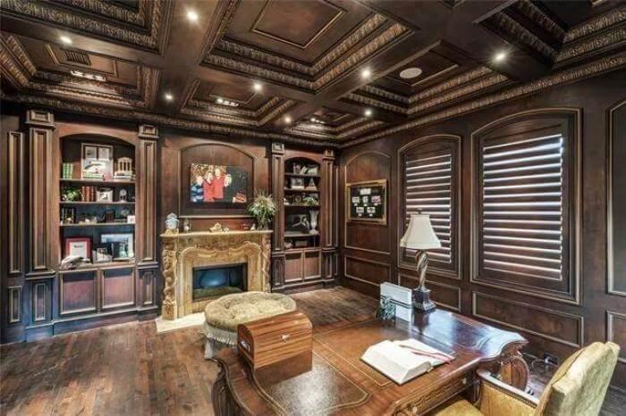 Step into This Richly Paneled Library with Intricate Ceiling Details