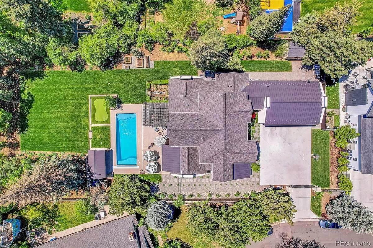 Take an Aerial Tour of This Craftsman Property with Lush Greenery and a Poolside Retreat