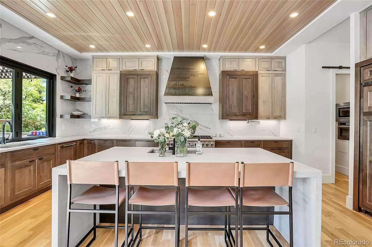 Wow, Look at the Rich Wooden Cabinetry and Sleek Marble Accents in This Kitchen