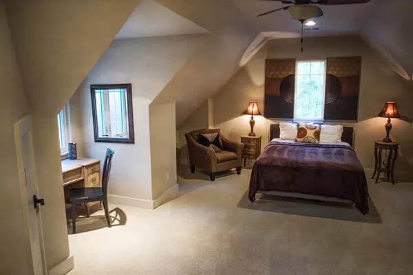 Explore the Cozy Nook and Artistic Accents in This Charming Bedroom