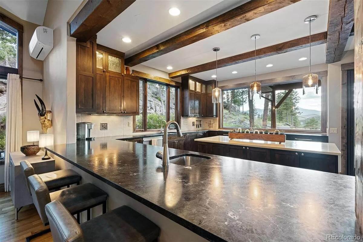 Kitchen with Expansive Counters and Forest Views