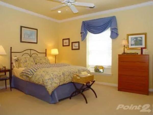 Serene Bedroom with Classic Iron Bed and Warm Tones