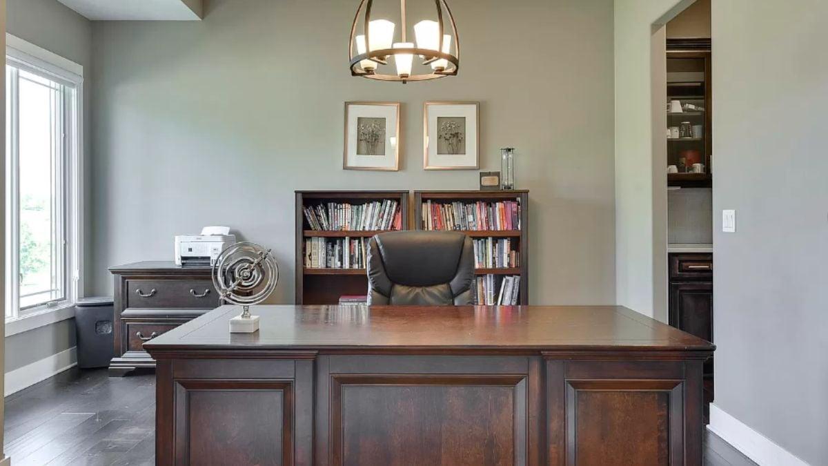Elegant Home Office with Dark Wood Furnishings and Ample Light