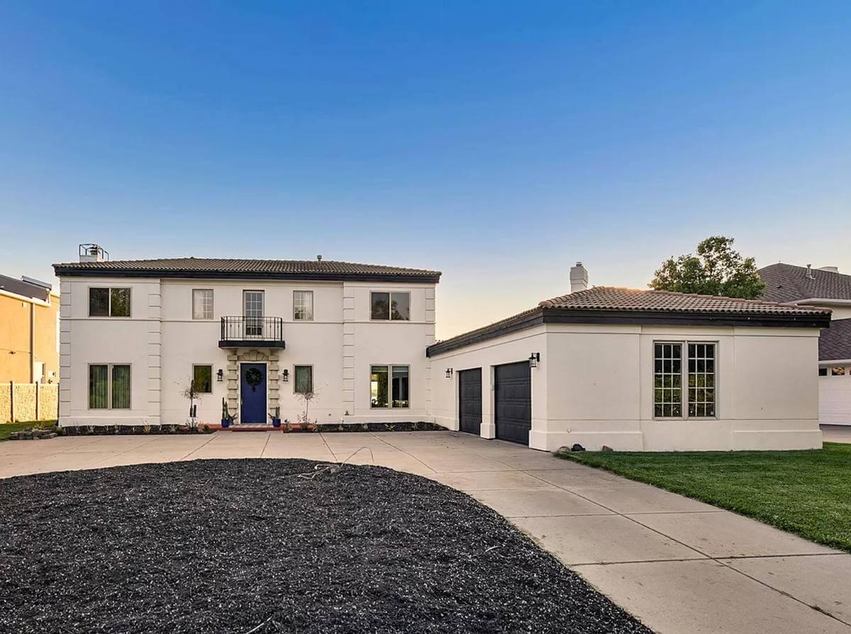 Mediterranean Charm with Bold Blue Accents and Detached Garage