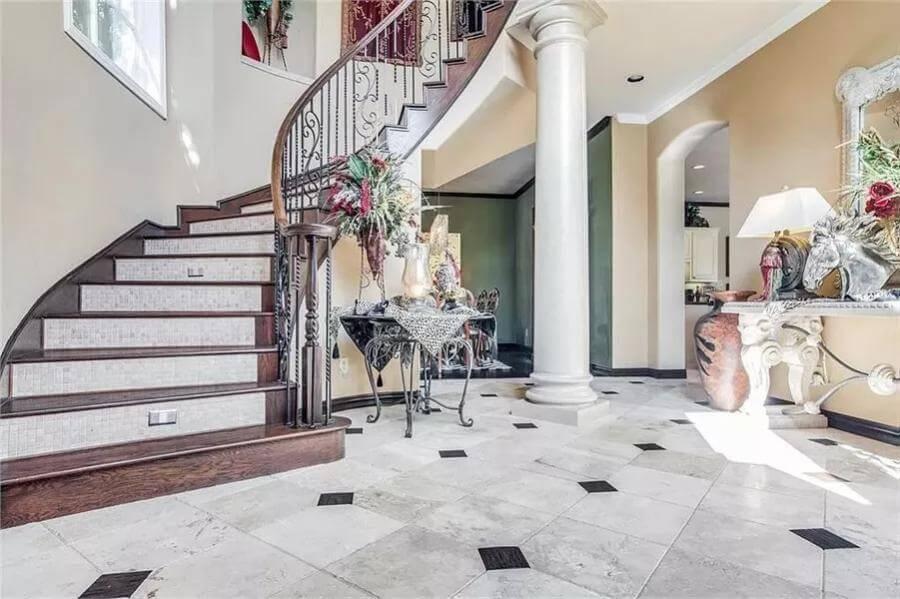 Notice the Glamorous Spiral Staircase Paired with Classic Columns