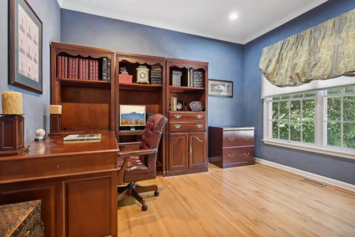 Home Office with Rich Wood Built-Ins and Cozy Window View