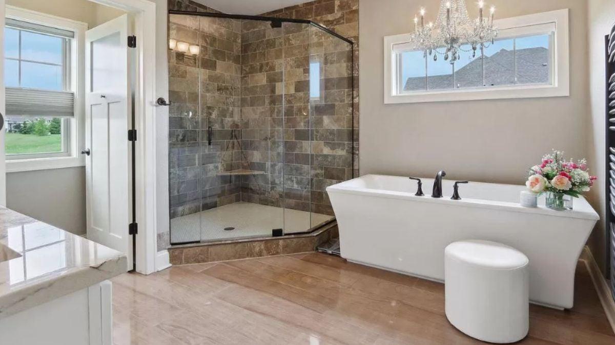 Luxurious Bathroom with a Freestanding Tub and Chandelier Touch