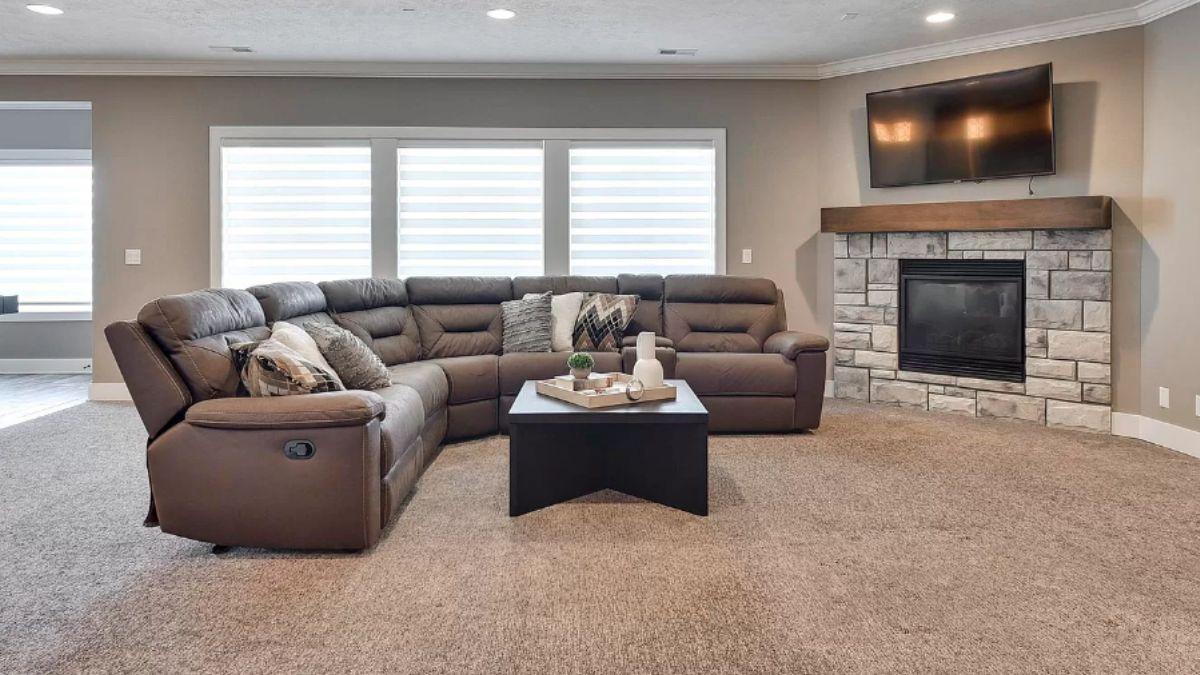 Comfy Living Room with Modular Sectional and Stone Fireplace