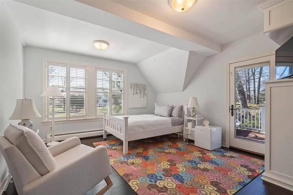 Spot the Multicolored Rug in This Bright Bedroom Retreat