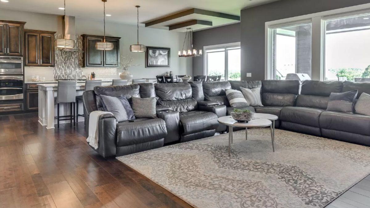 Check Out This Expansive Living Area with a Cozy Sectional and Bright Kitchen