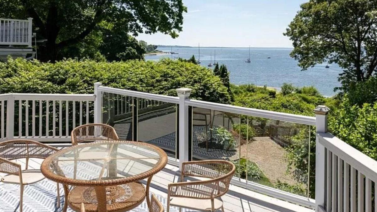 Charming Deck with Glass Railing Overlooking the Bay