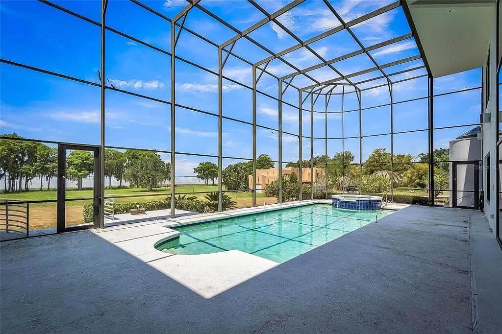 Notice the Expansive Screen Enclosure Surrounding This Pool