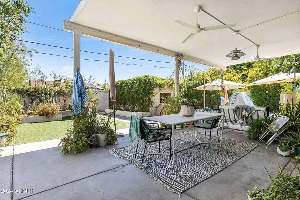 Relaxed Outdoor Dining Space with Lush Greenery