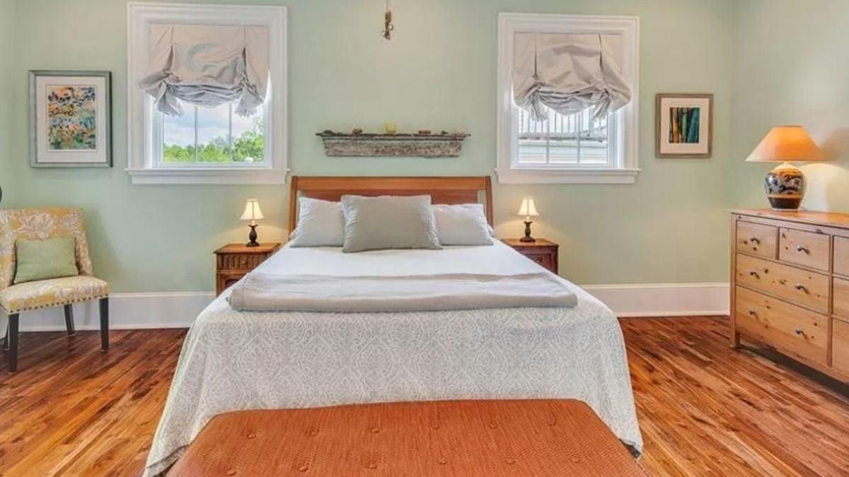 Tranquil Bedroom with Soft Mint Walls and Wooden Accents