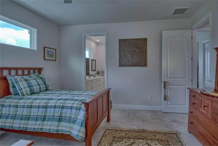 Craftsman Bedroom with Rich Wood Details and En Suite Access