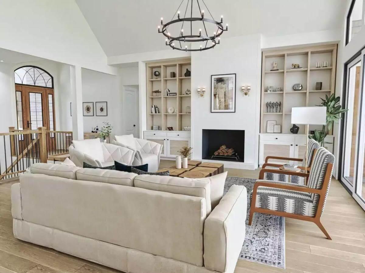 Bright Living Room with Built-In Shelving and Rustic Chandelier