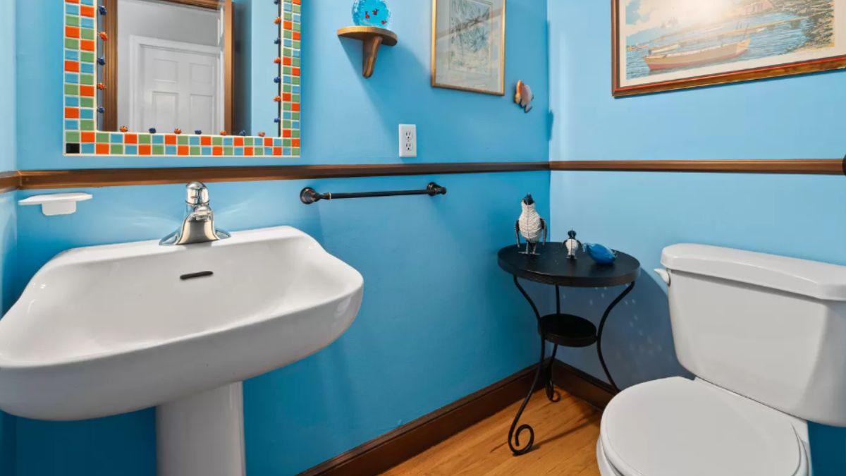 Check Out the Playful Tile Frame in This Vibrant Powder Room