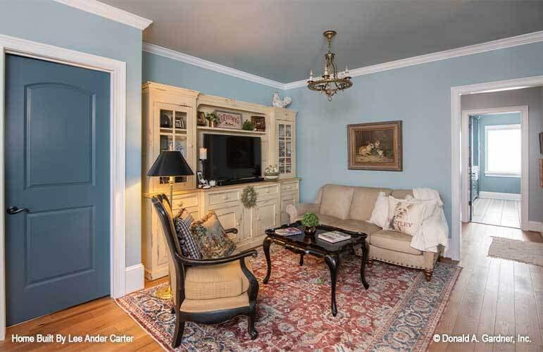 Charming Sitting Room with Vintage Cabinetry and Timeless Charm