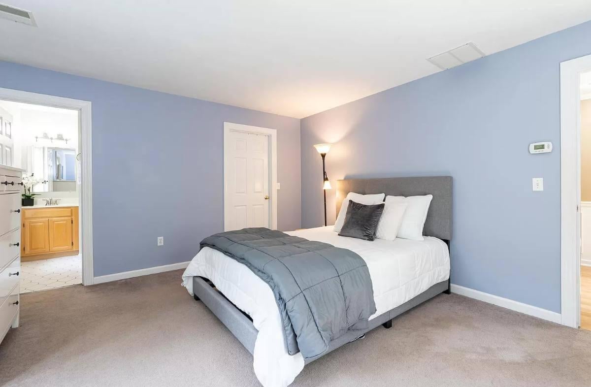 Calm Bedroom with Soft Blue Walls and Gray Accents