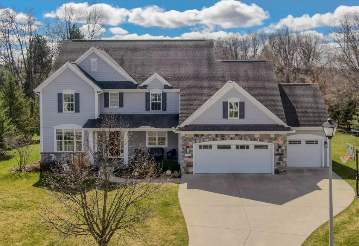 Traditional-Style 5-Bedroom Home for a Sloped Lot with Jack & Jill Bathroom (4,235 Sq. Ft. Floor Plan)