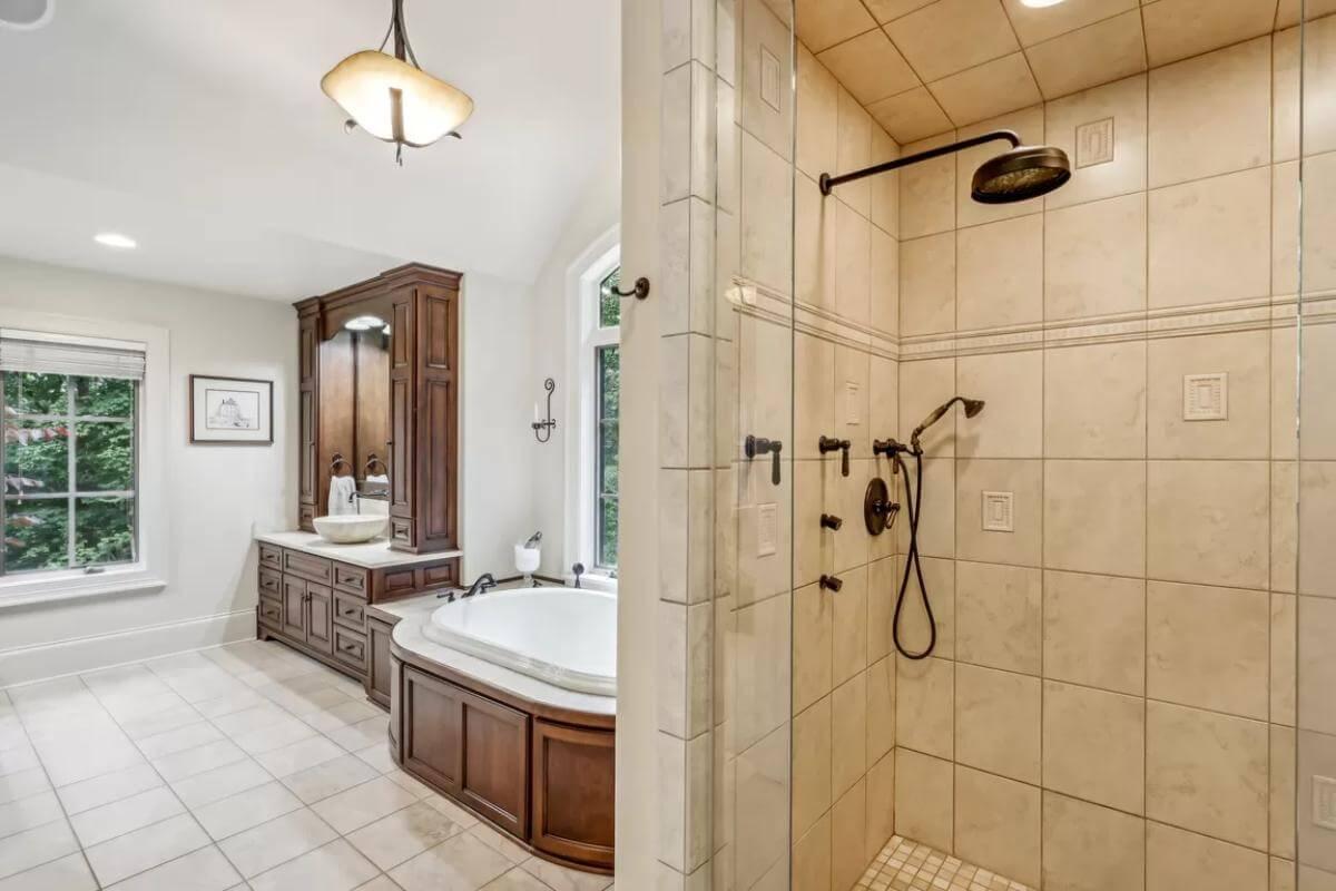 Admire the Wooden Cabinetry and Spacious Shower in this Craftsman Bathroom