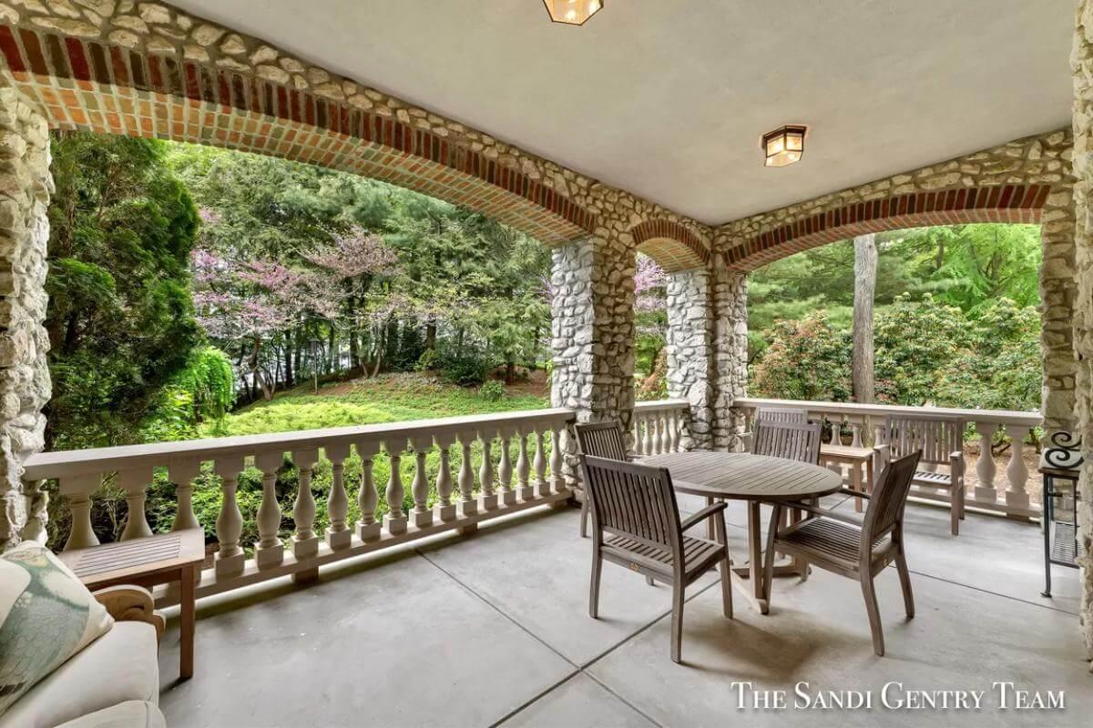Relax on the Stone-Walled Terrace with Lush Garden Views