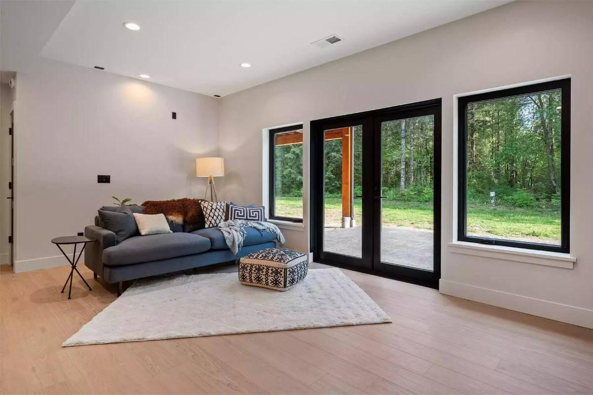 Cozy Living Space with Forest Views and Sleek Patio Access