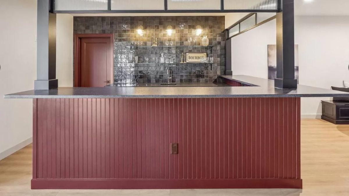 Explore the Bold Red Accent in This Home Bar Setting