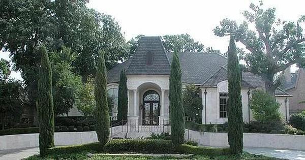Formal Front Entrance Framed by Tall Cypress Trees