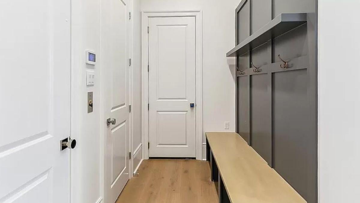 Efficient Mudroom with Built-in Bench and Storage Hooks