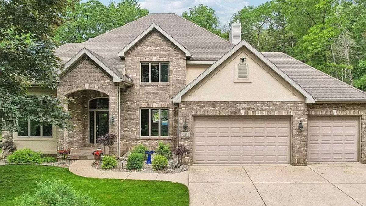 Charming Brick Facade with Triple Garage Ready for Your Vehicles