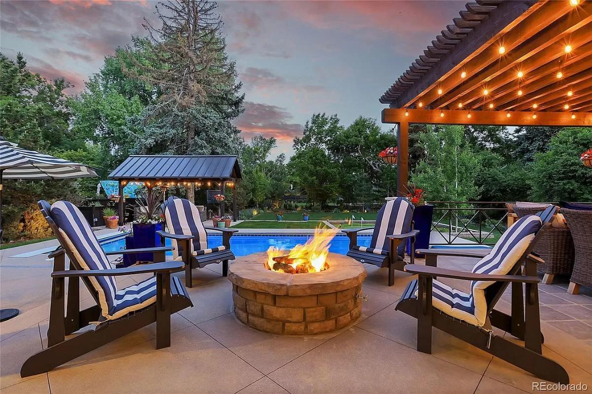 Relax by the Fire Pit in This Inviting Outdoor Oasis