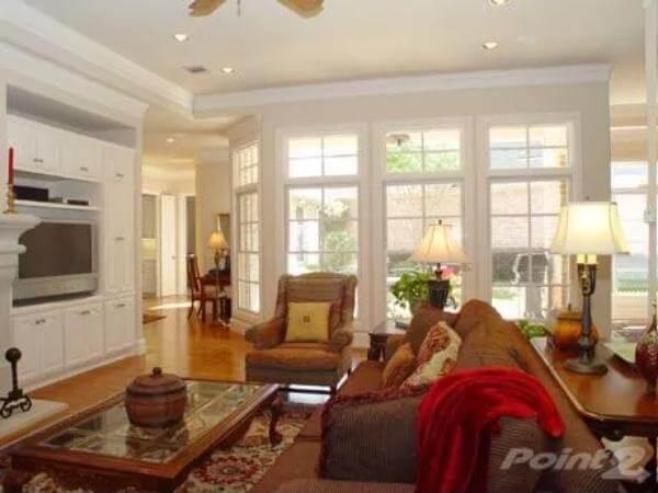 Notice the Sunlit Living Room with Built-In Entertainment Center