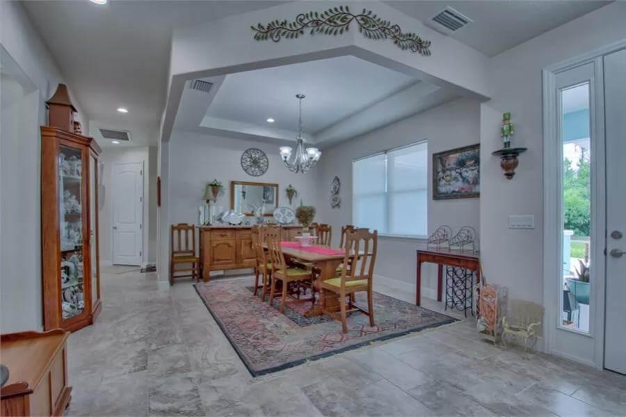 Step into the Dining Room with Its Tray Ceiling and Classic Elegance