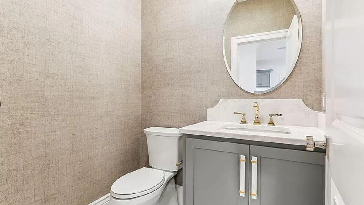 Explore the Elegant Simplicity of This Chic Powder Room