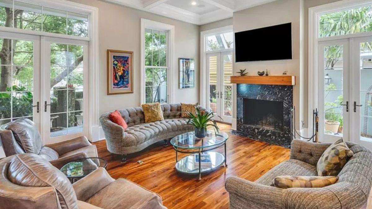 Warm Living Room with Stylish Curved Sofa and Rich Natural Light