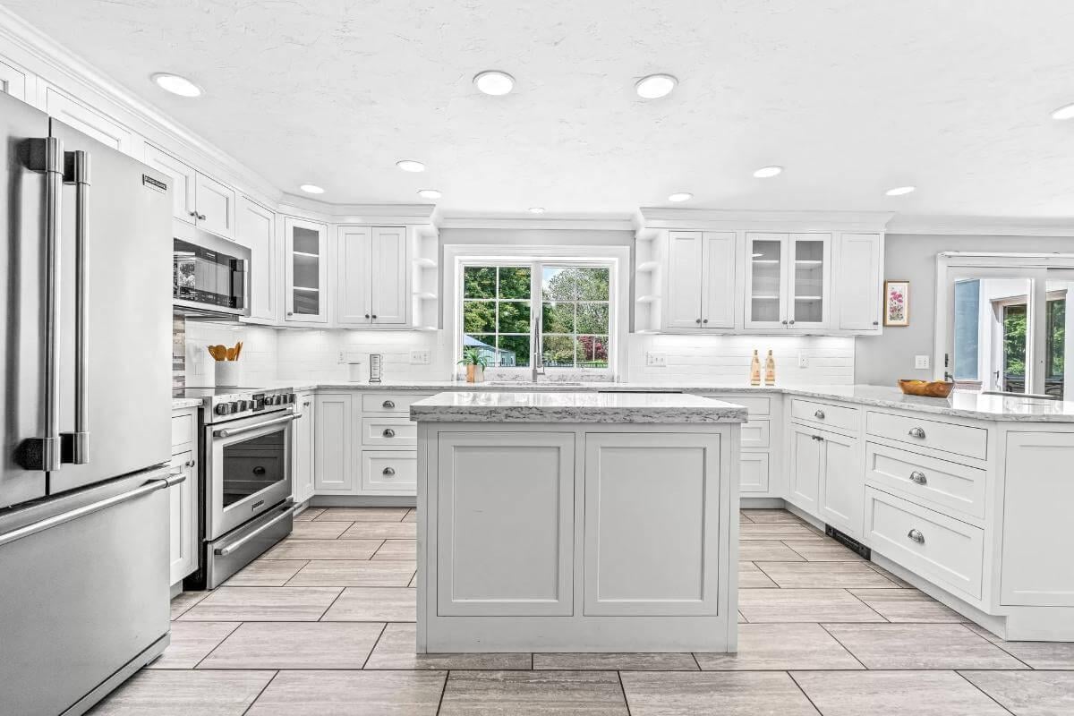 Admire the Expansive Island in This All-White Kitchen Oasis