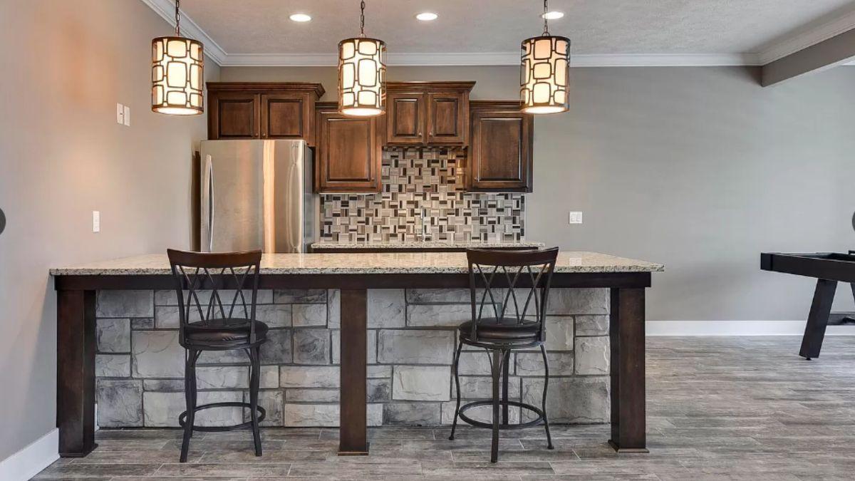Notice the Stone Bar Front and Striking Pendant Lights in This Space
