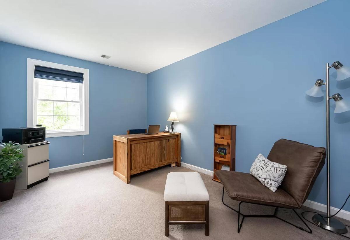 Tranquil Home Office with Blue Walls and Streamlined Desk