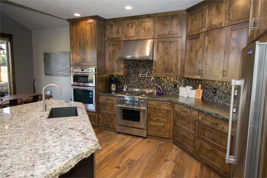 Check Out This Spacious Craftsman Kitchen with Granite and Wood Details