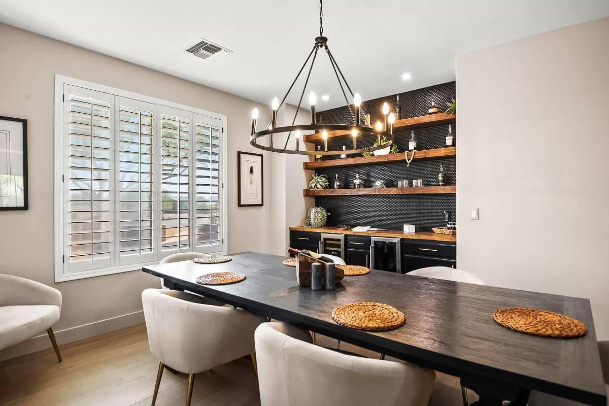 Check Out the Bold Open Shelving and Industrial Chandelier in This Dining Room