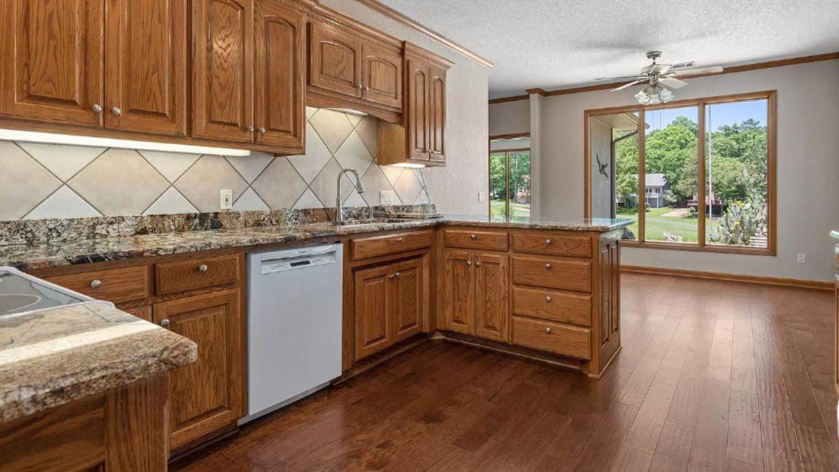Warm Kitchen with Granite Countertops and Wood Cabinetry