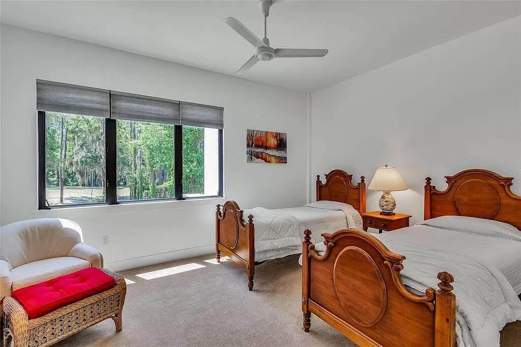 Twin Retreats in a Sunlit Room with Classic Wooden Beds
