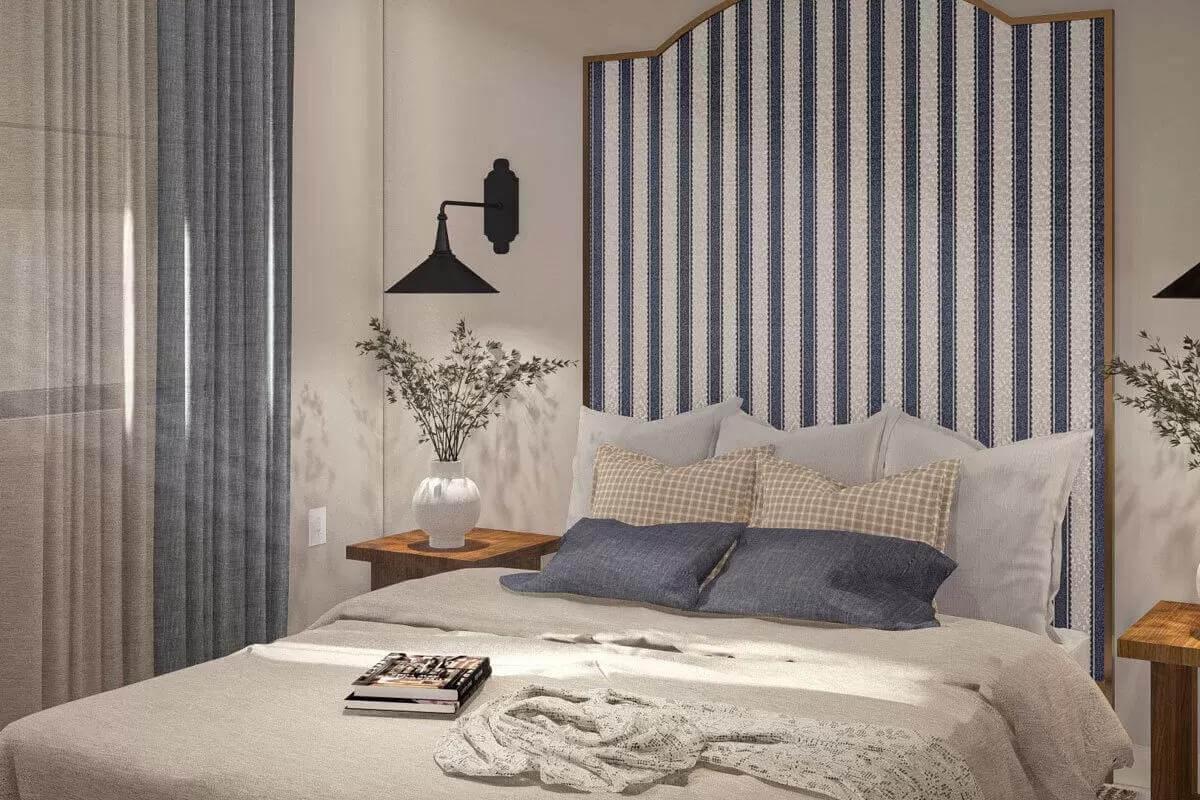 Cozy Bedroom with a Striped Headboard and Sconces