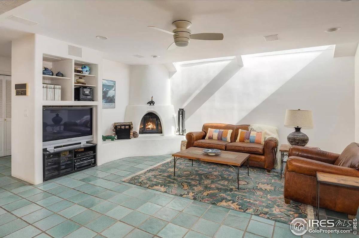 Southwestern Living Room with Kiva Fireplace and Vibrant Tiles
