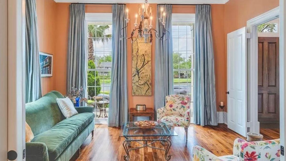 Charming Sitting Room with Playful Floral Accents and Chandelier