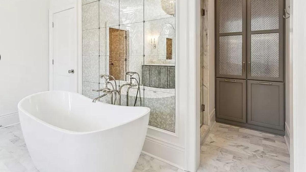 Discover the Luxury of Mirrored Walls and a Freestanding Tub
