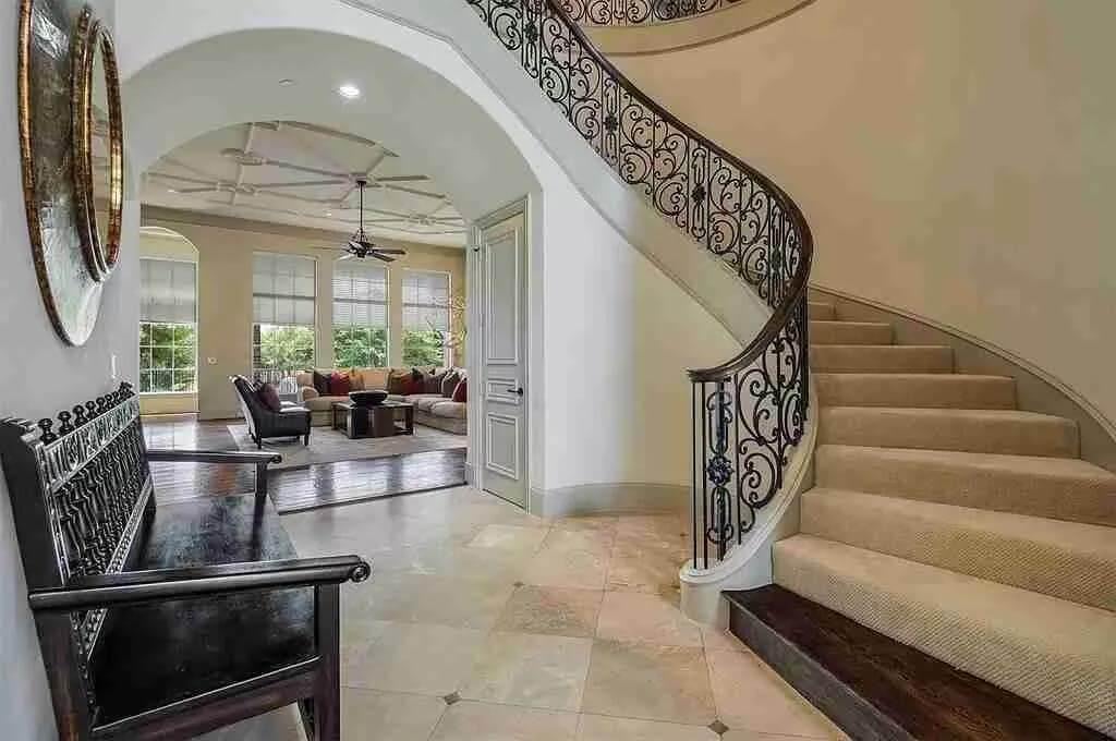 Explore This Elegant Spiral Staircase Leading to a Cozy Living Area